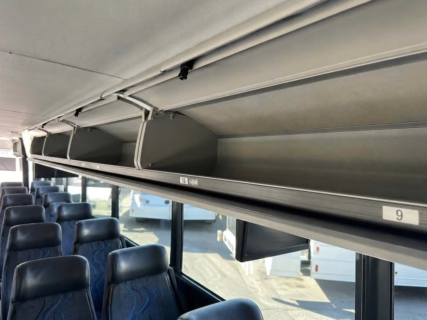 monrovia 56 passenger charter bus overhead storage
